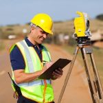 land surveyor working on the road